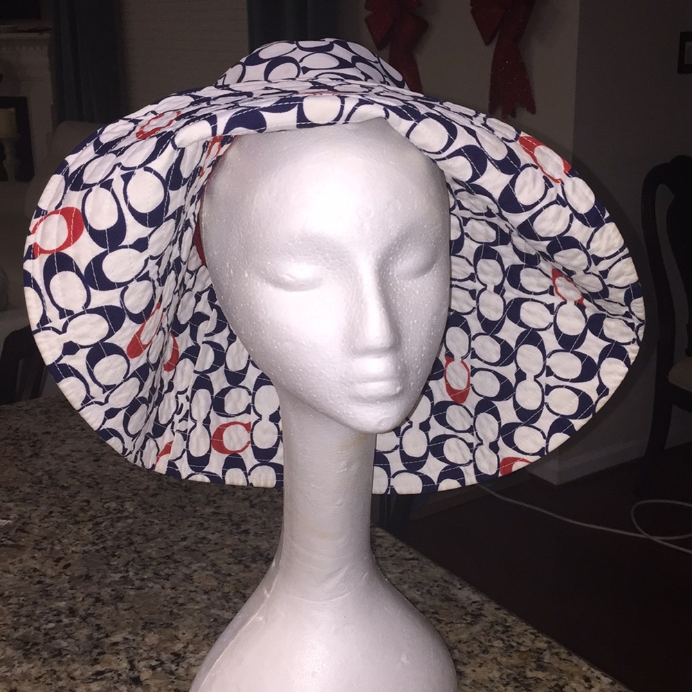 Authentic “Coach” beach hat...it’s big, bold & hot